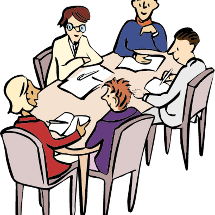 Arbeitsgruppe am Tisch (öffnet vergrößerte Bildansicht)