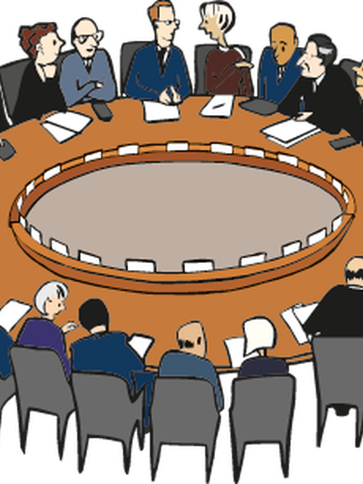 Konferenz an einem großen runden Tisch (öffnet vergrößerte Bildansicht)